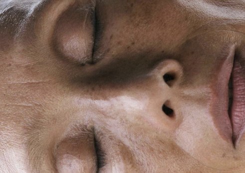 Close-up of a calm face with eyes closed